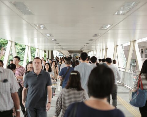 Workers in Hong Kong walking on footbridge to Wan Chai Immigration Building Photo by Airam Dato-on on UnsplashPhoto by Airam Dato-on on Unsplash