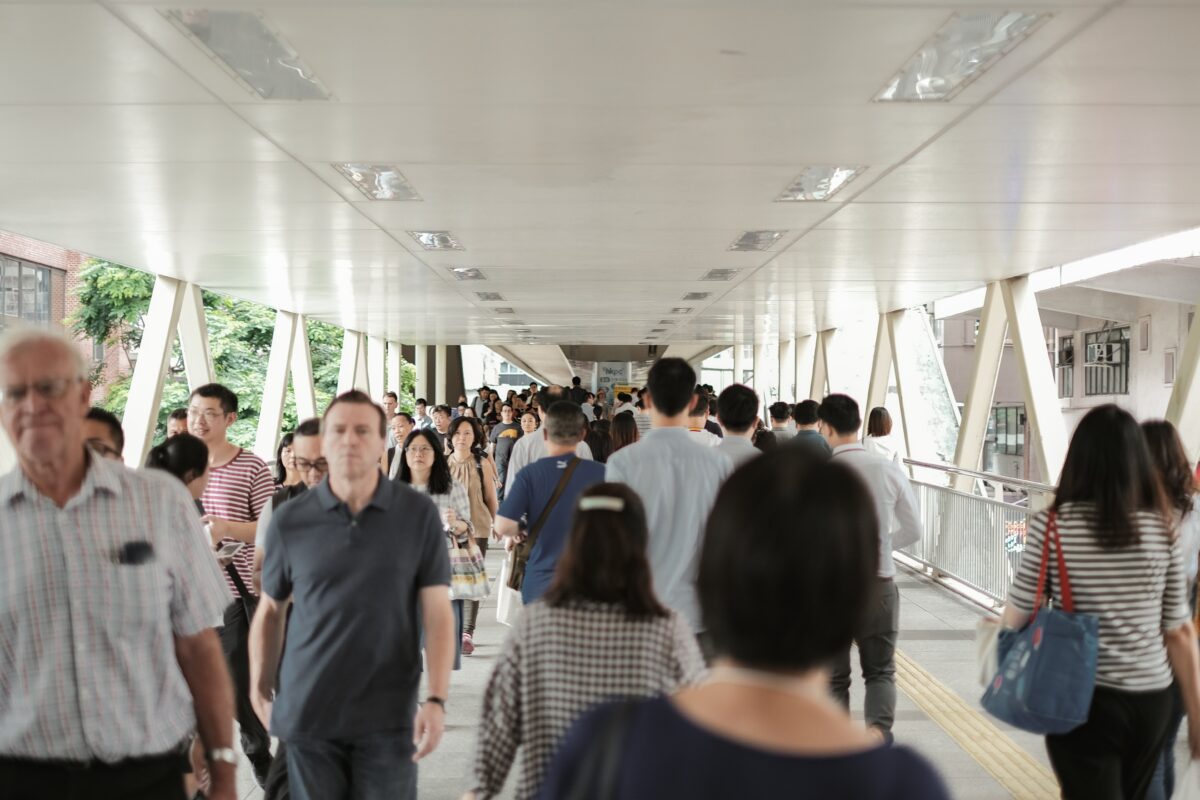 Workers in Hong Kong walking on footbridge to Wan Chai Immigration Building Photo by Airam Dato-on on UnsplashPhoto by Airam Dato-on on Unsplash